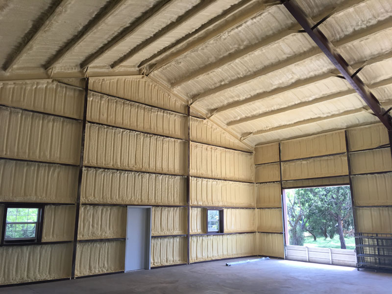 showing the spray foam insulation installation inside a metal building and barn